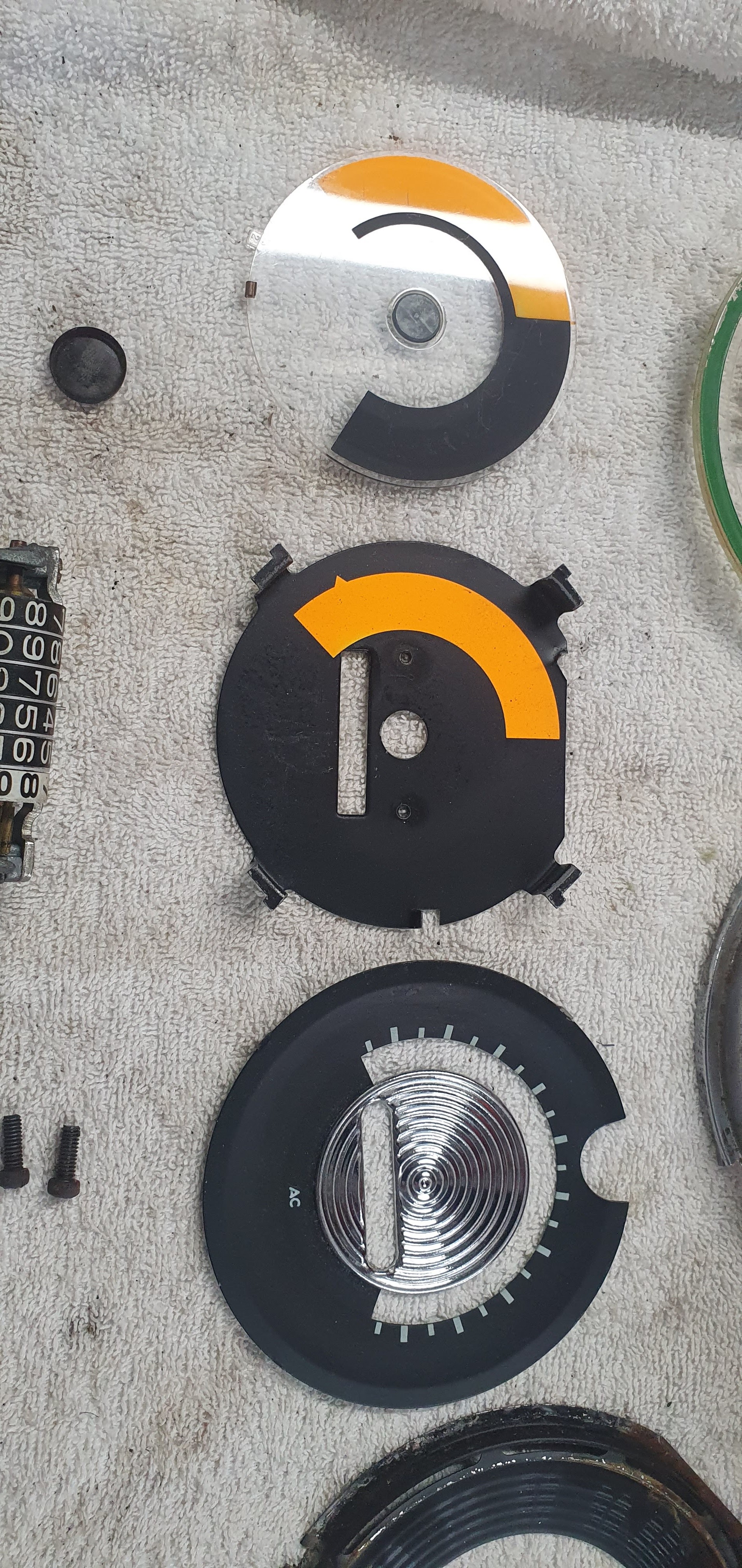 The backing plate with orange segment and the disc