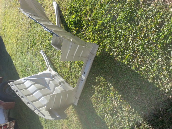 finished repair to radiator support and primed.
